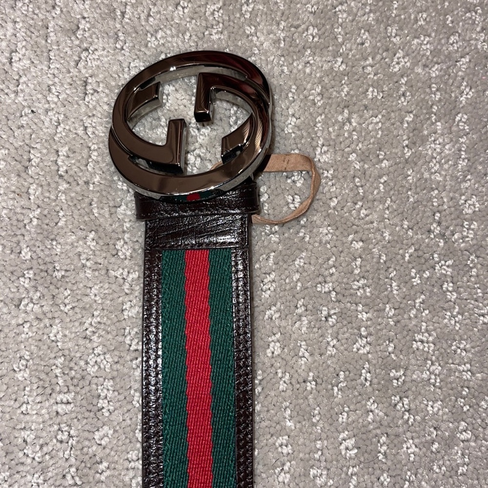 Like new man’s striped with Brown on the outlining belt